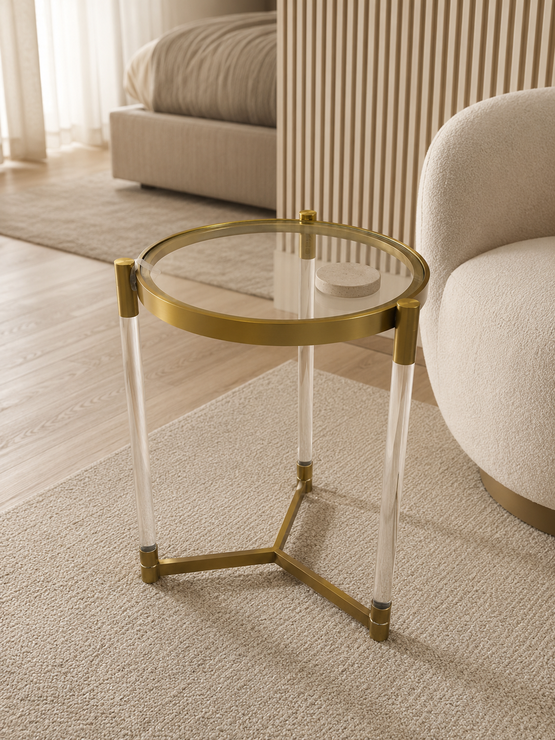 Lucent round glass corner table with clear acrylic legs and PVD gold stainless-steel frame